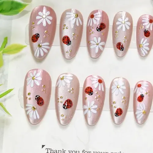 White Flower and Ladybug Gold Foil Cat Eye Almond Press-On Nails photo 2