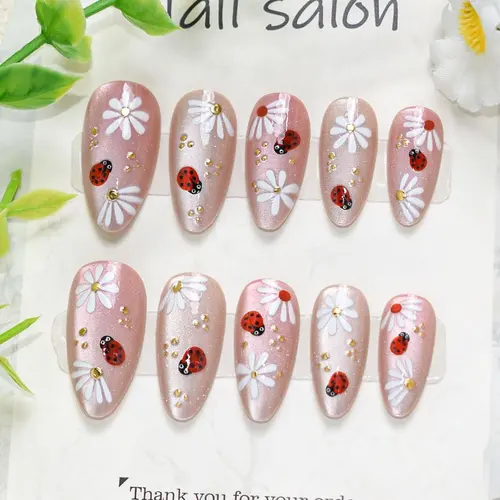 White Flower and Ladybug Gold Foil Cat Eye Almond Press-On Nails photo 4