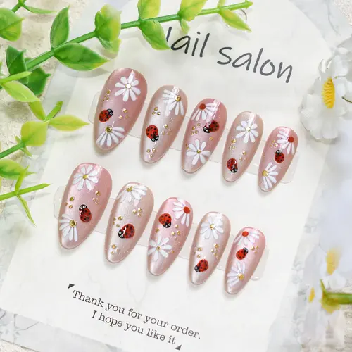 White Flower and Ladybug Gold Foil Cat Eye Almond Press-On Nails photo 5
